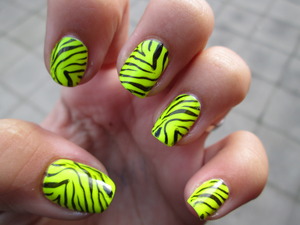 This is a neon yellow nail polish that I bought in Spain. I added the konad zebra design from the m57 image plate. Hope you like it! Blogpost: http://nailartbylynn.tumblr.com/post/27637563272