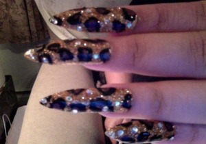 Leopard Print Nails
Done in Gold polish, gold glitter, with clear jewels