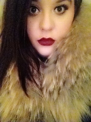 A bold lip and a fur collar. Holiday Winter Glam