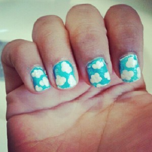 These are cloud nails inspired by the sky. I used a dotting tool to get the cloud effect. 