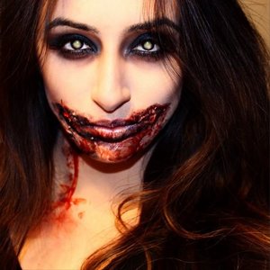 Halloween 2014 Zombie Makeup! 
I used mostly white face paint, scarwax, and fake blood!