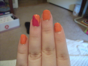 I tried to do the design where you tape off part of your nail and paint a color on top. I didn't let it dry long enough cause I'm impatient, so I carefully repainted the pink part! 
pink: Fuschia Girl- Covergirl
orange: Sun Kissed- Sally Hansen