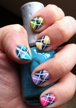 Aren't these so cute?!? Thanks to MissJenFabulous for her fantastic tutorial! http://www.beautylish.com/v/ruyuqx/easy-argyle-print-nails

I don't have her skill but those little imperfections dont show up in real life as much as in the close up. 