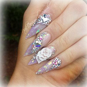 3D sculpted roses and tones of crystals on my wedding nails