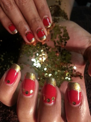Beautiful Red gel polish with gold pigment burnished onto the tips ..and medallions of gold dot the moons of this Indian bride.