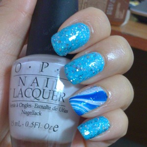 it was done by me, I used white opi lacquer and blue glitter lacquer