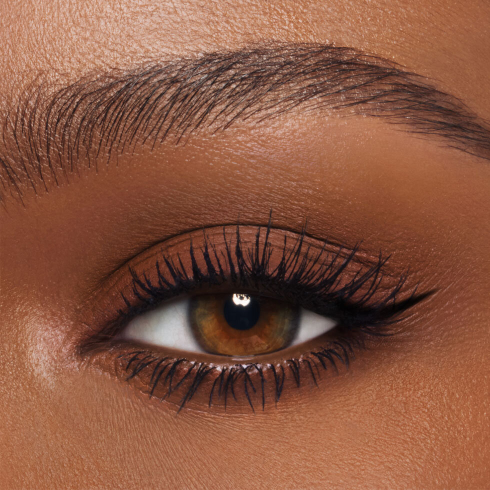 Charlotte Tilbury model wearing the Exagger-Eyes Waterproof Eyeshadow Stick in Desert Sculpt