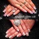 Top- acrylic French black & neon pink. Bottom- baby pink sparkle gel polish on clear acrylic 