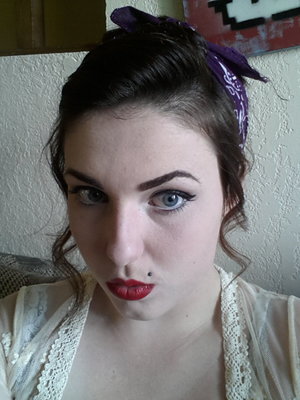 classic updo with bandana red lipstick by katy perry, thick brow and winged felt eyeliner