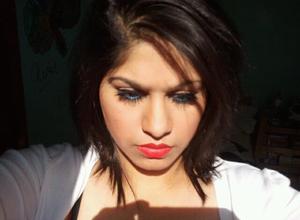 i love how the blue eyeliner and bright red lip POP when the sun is on my face  