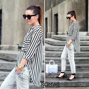 Black-cream shirt. Featuring unique collar, long sleeves, buttoned cuffs and front, twin pockets on chest, black stripes print throughout, unique hem, loose styling.