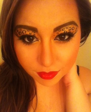Cheetah print eyes with red lip