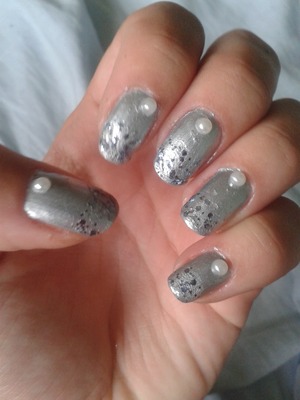 silver nail art with glitter and pearls