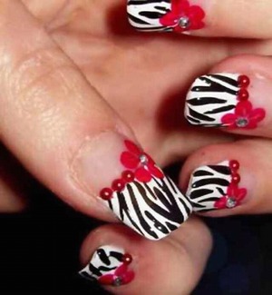 Zebra print and red flower nails. Still not mine though I wish. 