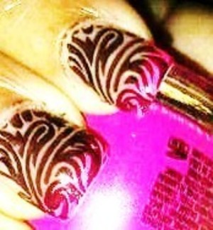 hot pink tips w/ black designs 
I used the konad nail stamping art kit
