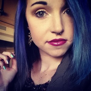 Blue hair, A-line cut. 