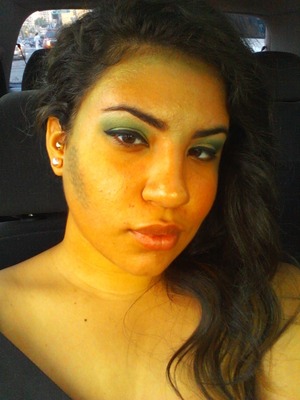 went to the mermaid parade in brooklyn, decided to do a mixed green look with scales across my cheek and big curls coming down one side