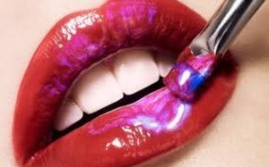 okay so get red pink and purple and regular gloss and put them all on a different plate and first put the red and the gloss on then mix the pink and purple
