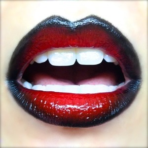 This is the lip look I did for the Kiss & Mötley Crüe Gig. I wanted a really dramatic red and black lip to go with the glam look which has it's own post here, complete with OOTD. 

This is the first time I wore my new Lime Crime Candy Apple Carousel gloss and it blended deliciously with the ombre lip I created and the sparkle and shine really punched up the OCC lip tars, NSFW and Tarred.

http://michtymaxx.blogspot.com.au/2013/03/kiss-motley-crue-gig-lips.html