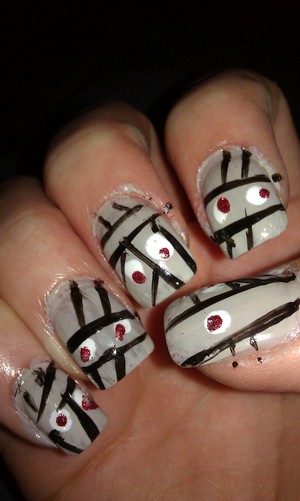 some Halloween mummy nails I did! first attempt, no judgement. I have no idea about any of the colors I used at all! 