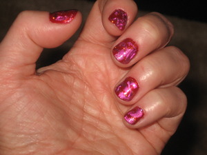 OPI in I'm All Ears
Foil and nail art glue in Rubelite Fire 
Nubar Nail Art Orange Glitter