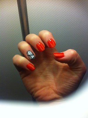 Red nails and black/silver marble nail