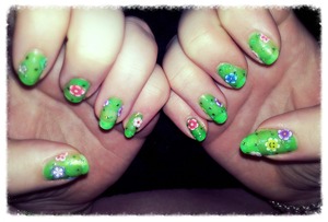 green polish with flower on it