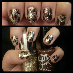 Gold glitter nail polish by Victoria Secret and brown Malibu Girl outlined with a Salley Hansen black nail art marker .