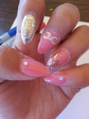 very light pink nails with a lil bit of glam on each one 