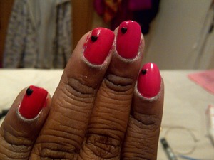 A pink base with a black nail-art heart.........Perfect for those days of feeling cutie and lovey and very simple to create