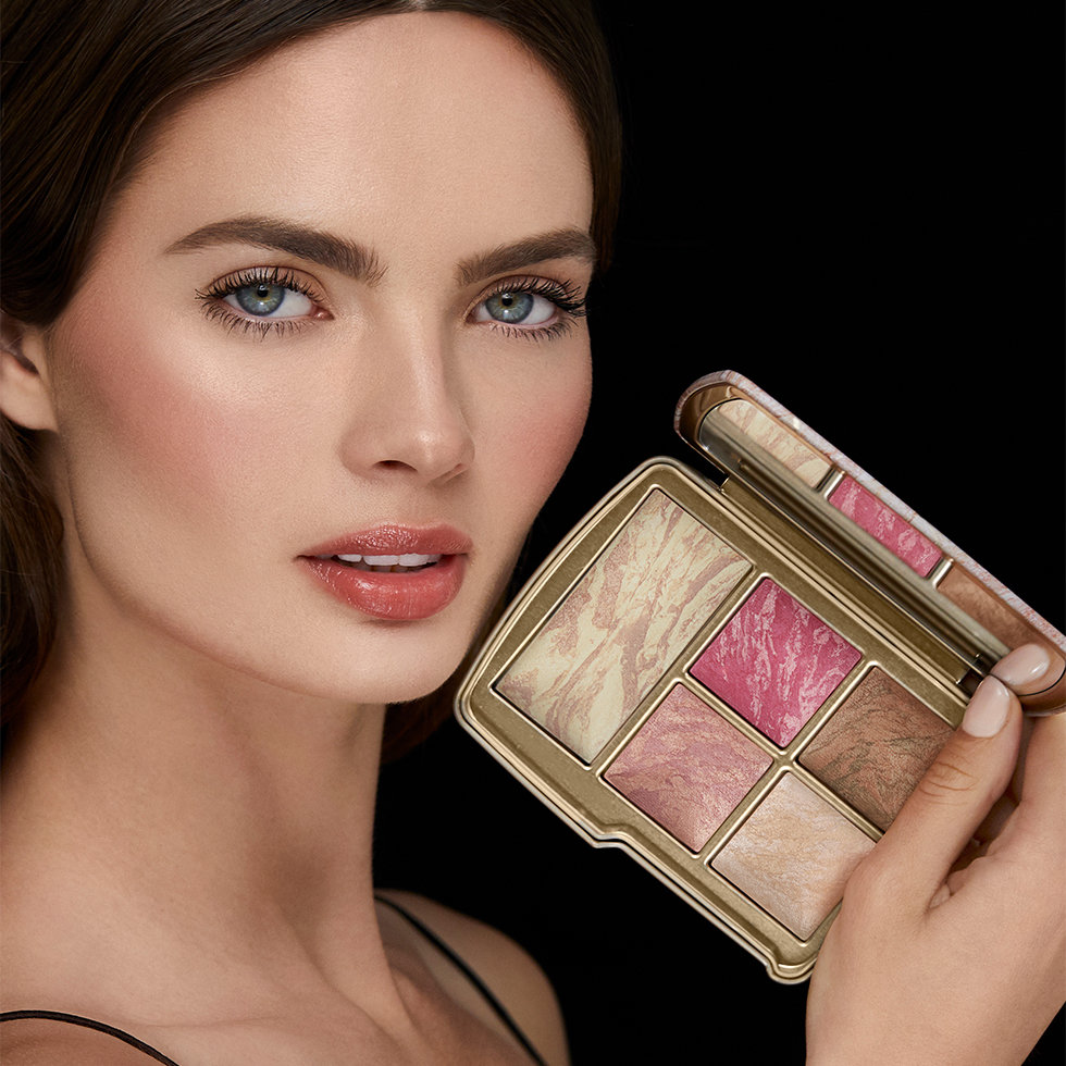 Hourglass model holding the Ambient Lighting Edit - Universe palette