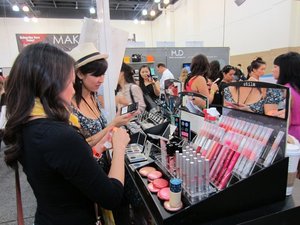 Testing products at Stila's booth at IMATS