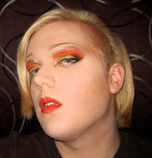 Vibrant reds, oranges, and yellows create a dramatic sunset gradient. Winged liner and some subtle black shadow in the crease add depth and a touch of "sultriness" to the look. Pair with either a vibrant orange or red lip, or a nude/natural lip for less pizazz. 