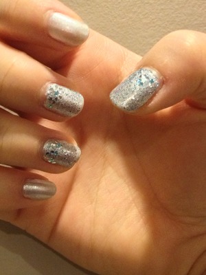 Light blue polish to start
Small blue and silver glitter polish all over on 3 randomly picked nails
Lastly, put bigger glitter on the base part of the 3 nails that already have glitter