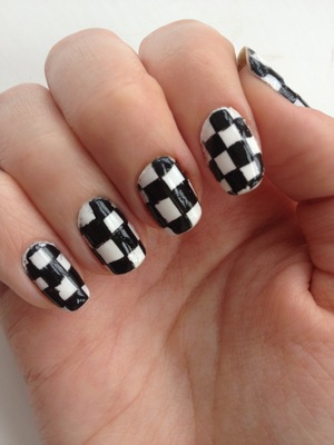 Simple checkered nails using white polish and a black striper :)