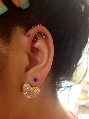 Triple forward helix piercing. | Beautylish