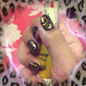 I used black as a the base and used my Sassy Nail Art to paint a leopard print on my nails. 