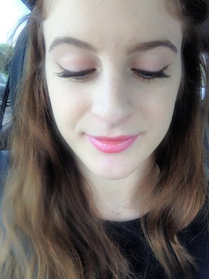 brown cat eye with a bright feline pink lip. 