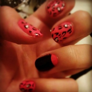 pink and black half moon nail art! cheetah like print with rhinestones....