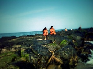This photo was taken at the beach on top of rocks it was me and my friend 