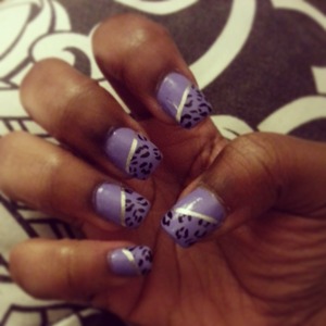 purple leopard print nails with silver lining. 