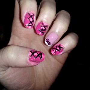 pink corset nails with bow and black laces