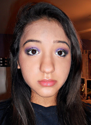 Bright purple smokey eye with gray in the inner corners and black on the outer corners, a white inner highlight and a gold liner accent 