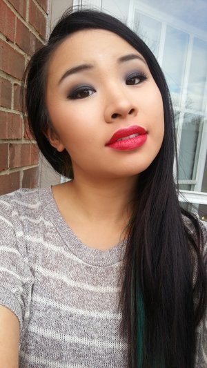 Matte black eyeshadow all over the lid, smoked out seamlessly. Lip color is Spotlight Red from Wet n Wild. Gotta love drugstore lipsticks!