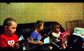 kids opening there Christmas gifts 2012.