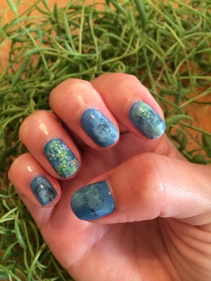 I got inspiration for these nails from a blue floral gown that was in fashion week!  What do you think?
Follow me on instagram: @bellanaildesign
The studs I used are available at tinyurl.com/bellanails