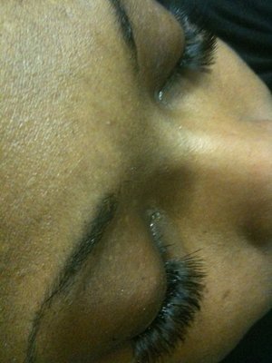 Individual Eyelash application on a client