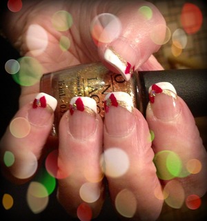 Festive French tips for the holidays! :)
For the French tips I used Sally Hansen White on. For the smile line I used OPI Golden Eye. For the bows I used a mixture of China Glaze Ruby Pumps and Cranberry Splash. For the center of the bows I used MAC 3D gold glitter mixed with some topcoat. I hope you enjoy this manicure! :)