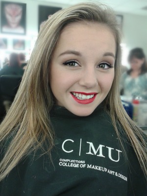 Makeup for class on a young model. Flawless skin, red lips, buried liner and a neutral eye :)