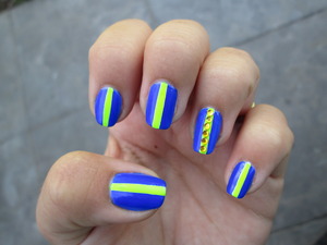 This is a combination of yellow and blue neon nail polish. I think these two colours go perfectly together. I added some yellow rhinestones on my ring finger. I used Spanish nail polishes for this design. Blogpost: http://nailartbylynn.tumblr.com/post/28348922526/